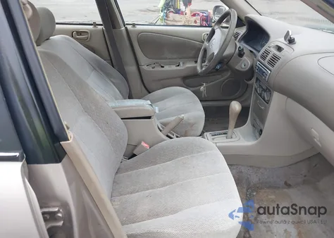 2001 Toyota Corolla Le z USA, uszkodzony, nr VIN 2T1BR12E41C430957